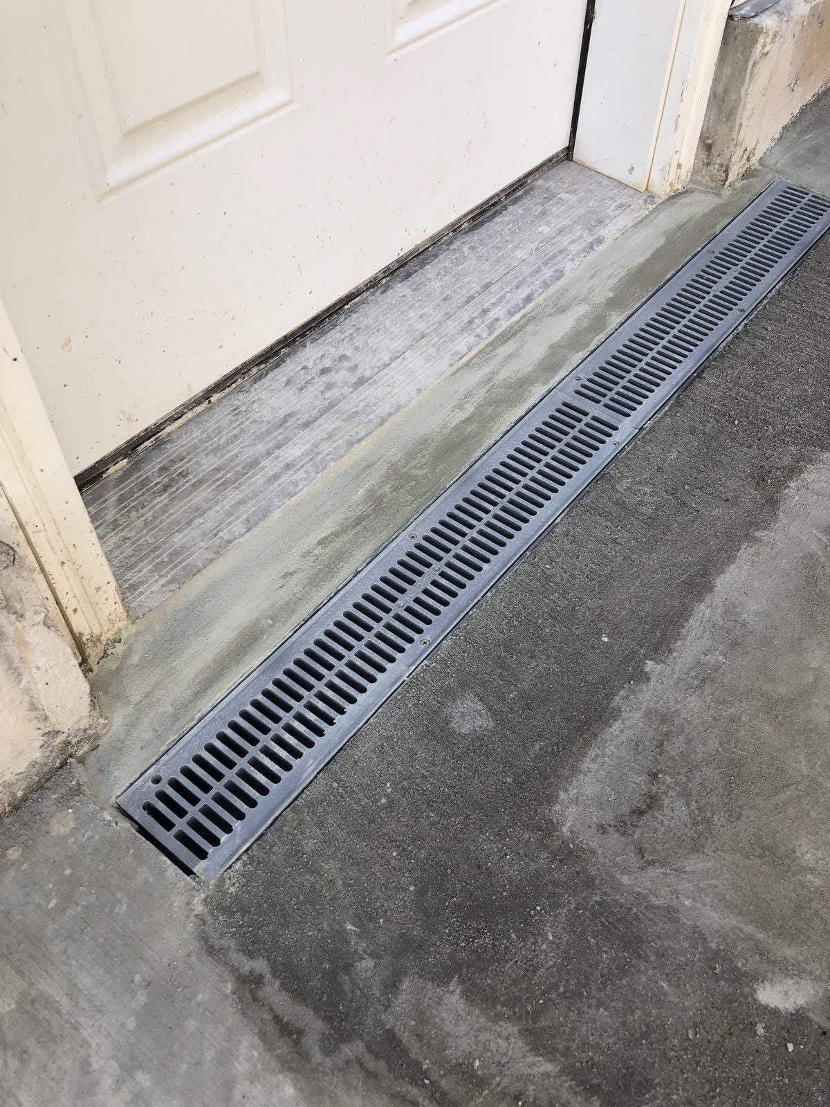 Channel drain set in a concrete slab
