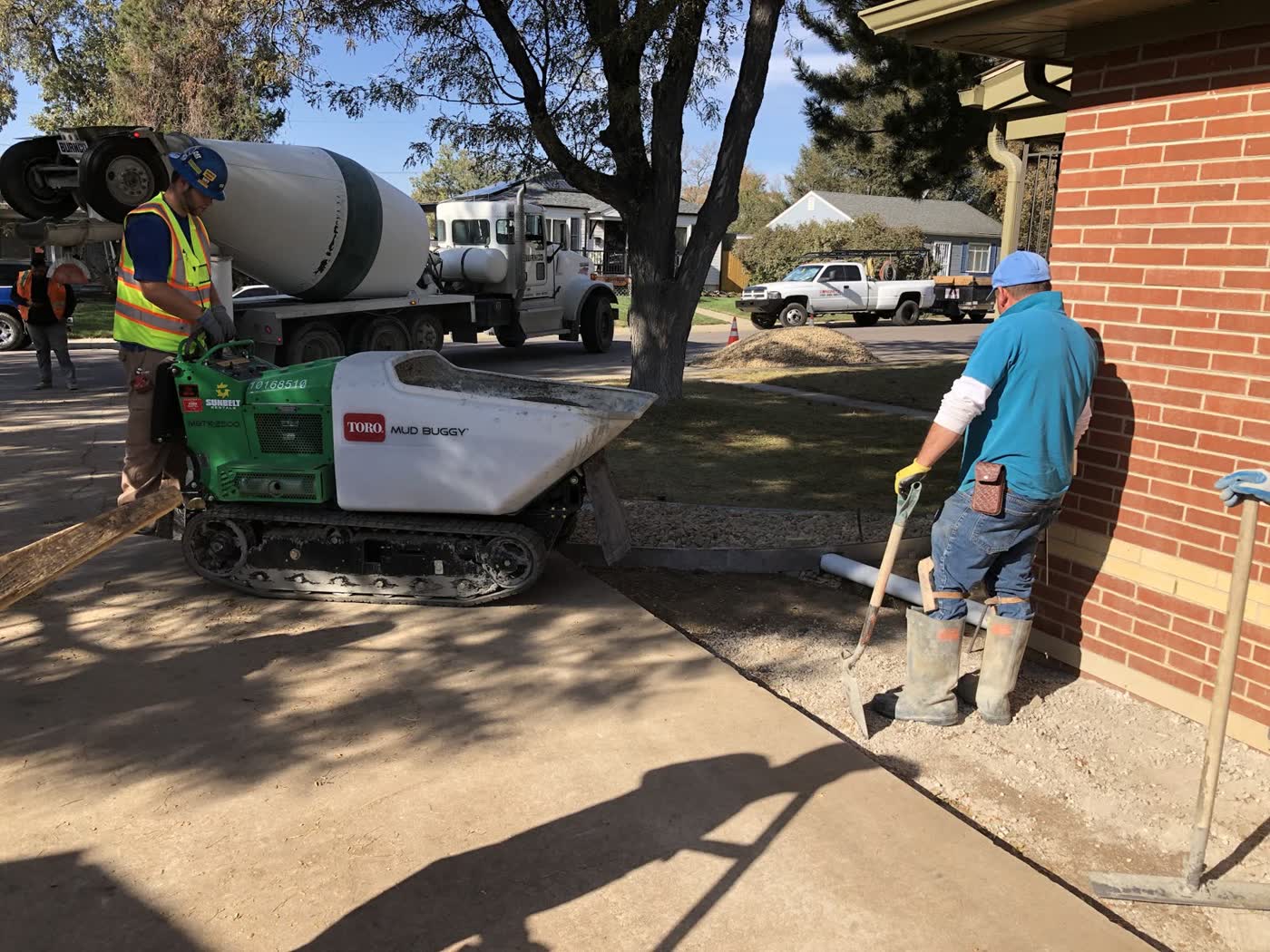 Crew placing concrete with a track buggy