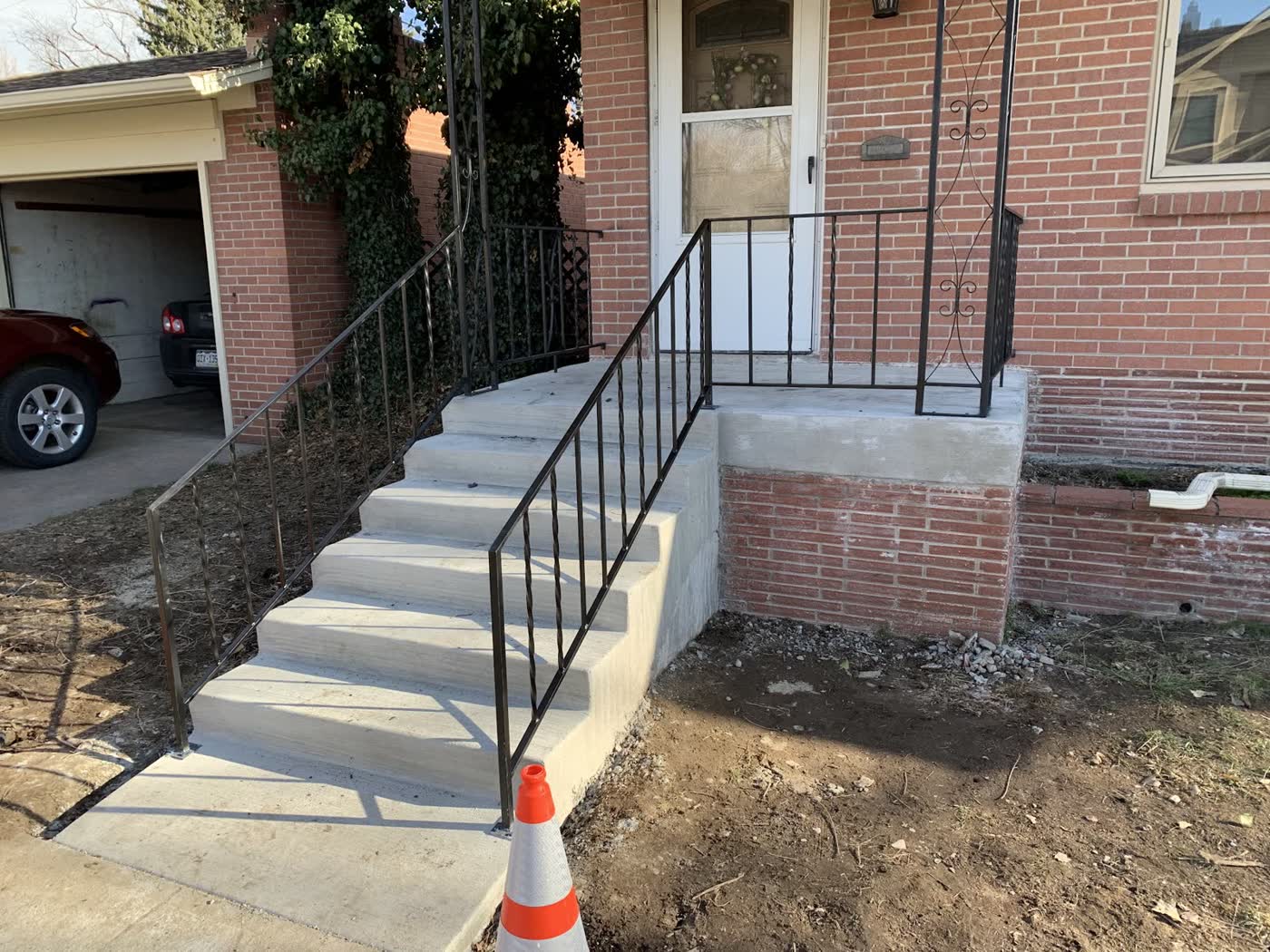 New concrete steps and porch at a brick home